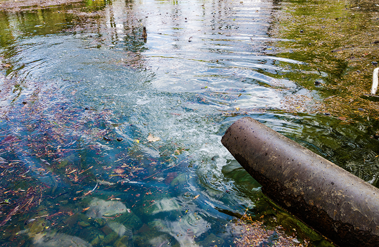 Pipe emptying into stream