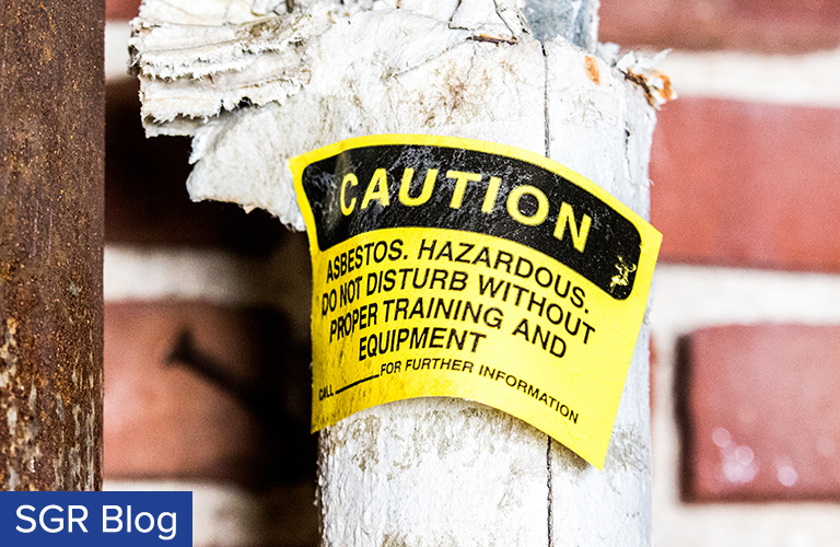 Asbestos Exposure: Warning on Pipe